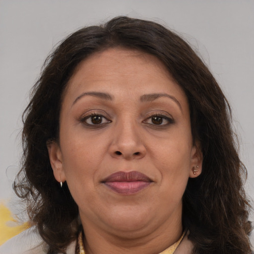 Joyful white adult female with medium  brown hair and brown eyes