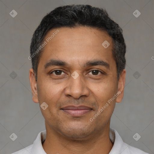 Joyful black adult male with short  black hair and brown eyes