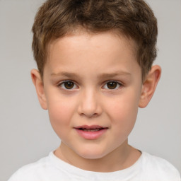 Joyful white child male with short  brown hair and brown eyes