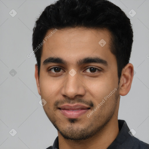 Joyful latino young-adult male with short  black hair and brown eyes