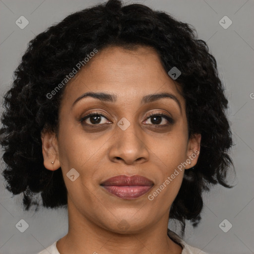 Joyful black adult female with medium  brown hair and brown eyes