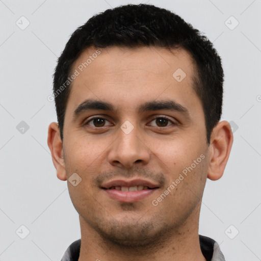 Joyful latino young-adult male with short  black hair and brown eyes