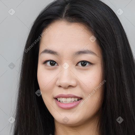 Joyful asian young-adult female with long  brown hair and brown eyes