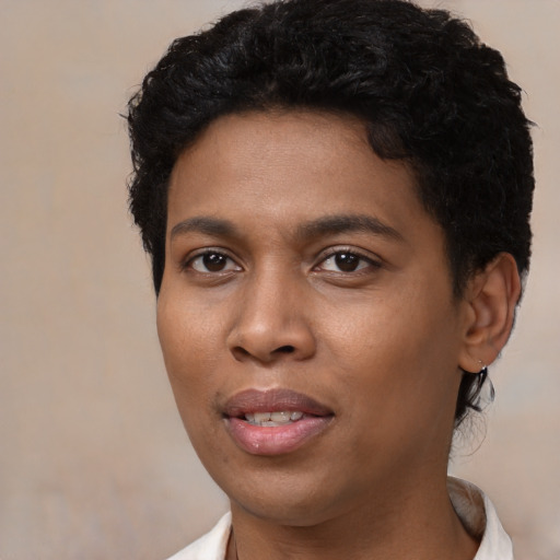 Joyful black young-adult female with short  black hair and brown eyes