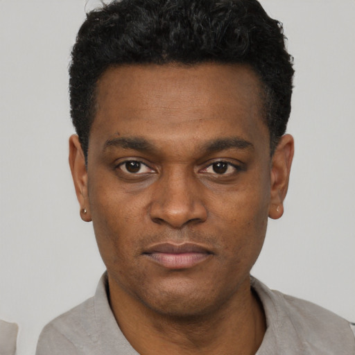 Neutral black young-adult male with short  black hair and brown eyes
