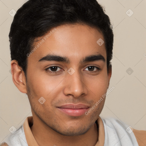 Joyful latino young-adult male with short  brown hair and brown eyes