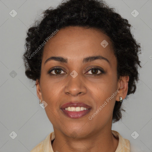 Joyful black young-adult female with short  brown hair and brown eyes