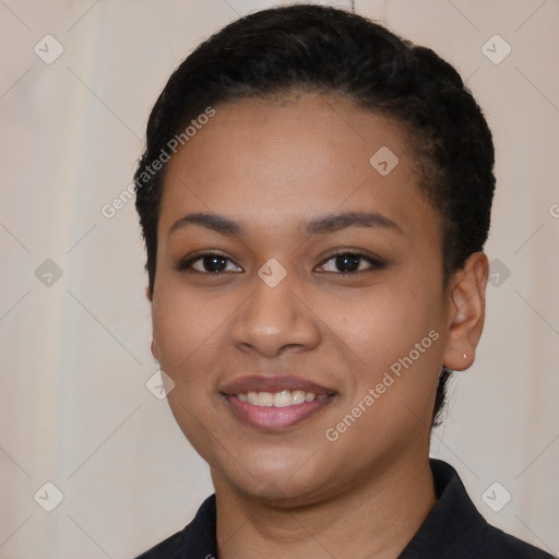 Joyful latino young-adult female with short  black hair and brown eyes