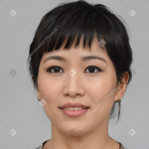 Joyful asian young-adult female with medium  black hair and brown eyes