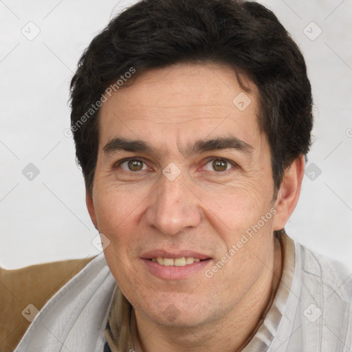 Joyful white adult male with short  brown hair and brown eyes