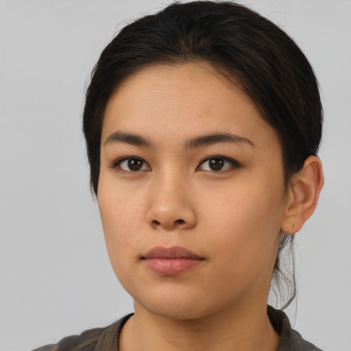 Neutral asian young-adult female with medium  brown hair and brown eyes
