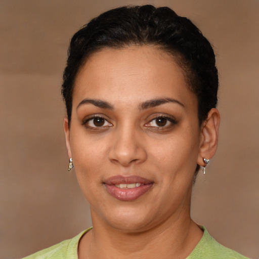 Joyful latino young-adult female with short  brown hair and brown eyes