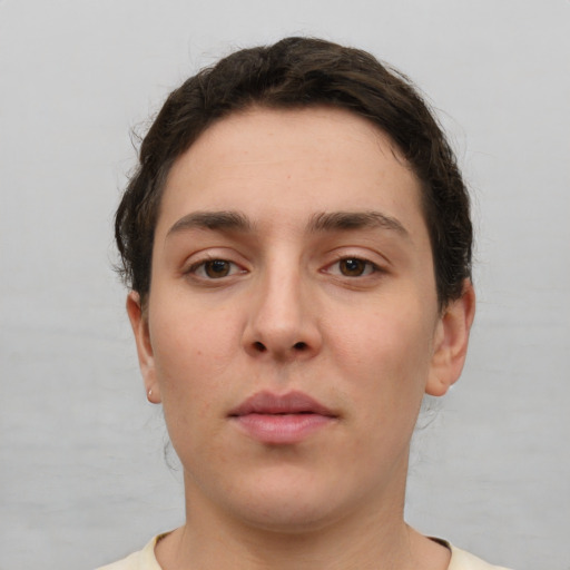 Neutral white young-adult female with short  brown hair and brown eyes