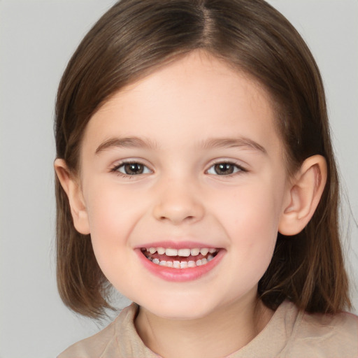 Joyful white child female with medium  brown hair and brown eyes