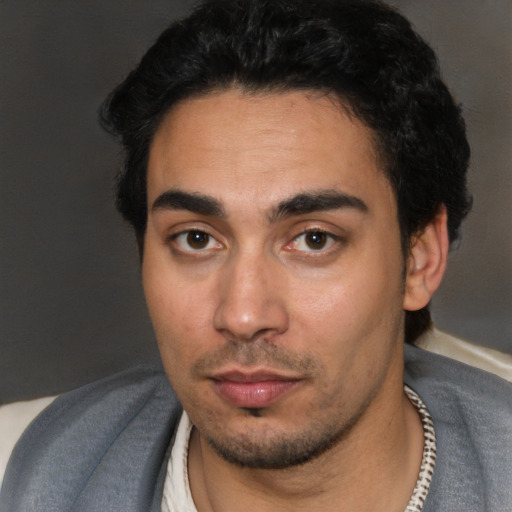 Neutral white young-adult male with short  black hair and brown eyes
