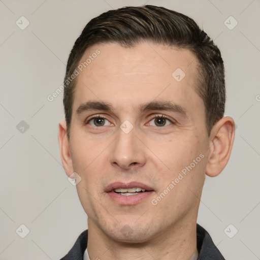 Joyful white adult male with short  brown hair and brown eyes