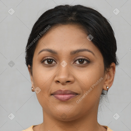 Joyful latino young-adult female with medium  brown hair and brown eyes