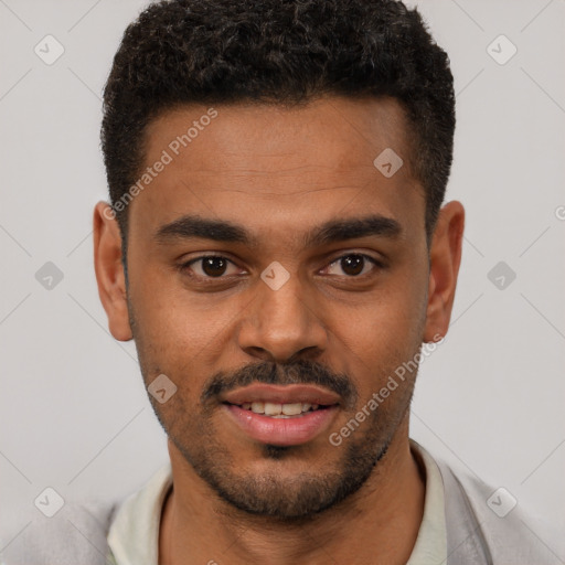 Joyful white young-adult male with short  black hair and brown eyes