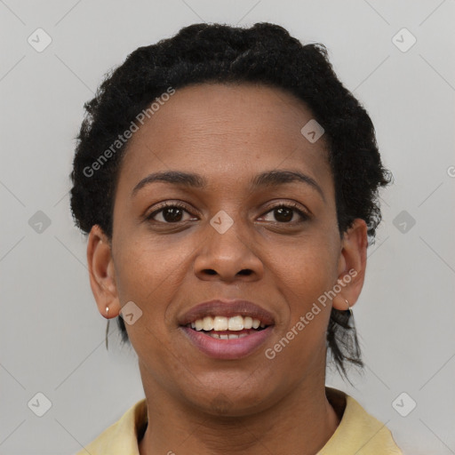 Joyful black young-adult female with short  black hair and brown eyes