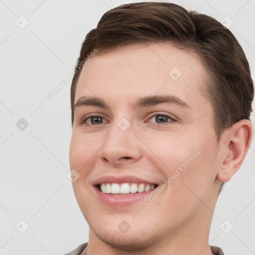 Joyful white young-adult female with short  brown hair and grey eyes