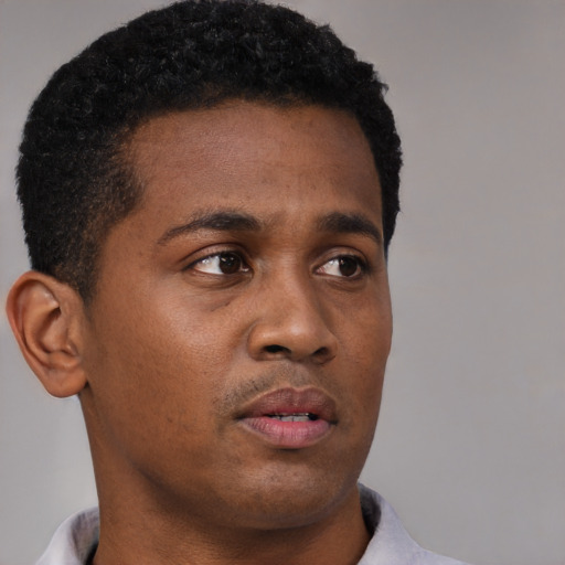 Neutral black young-adult male with short  black hair and brown eyes