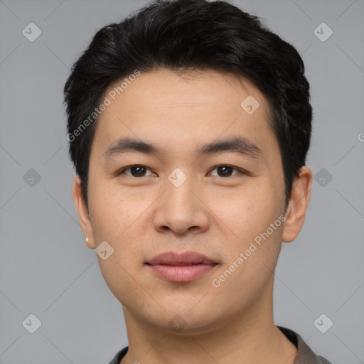 Joyful white young-adult male with short  black hair and brown eyes