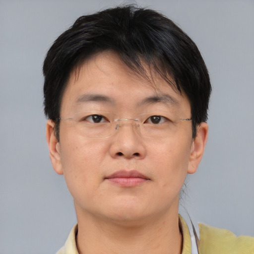 Neutral asian adult male with short  brown hair and brown eyes
