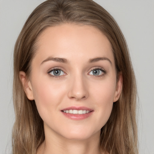 Joyful white young-adult female with long  brown hair and grey eyes