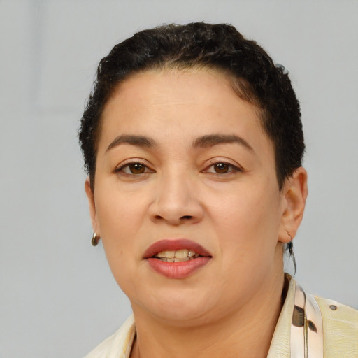 Joyful latino young-adult female with short  black hair and brown eyes