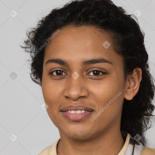 Joyful black young-adult female with medium  brown hair and brown eyes