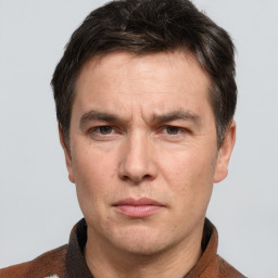 Joyful white adult male with short  brown hair and grey eyes