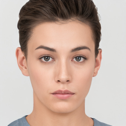 Neutral white young-adult female with short  brown hair and brown eyes