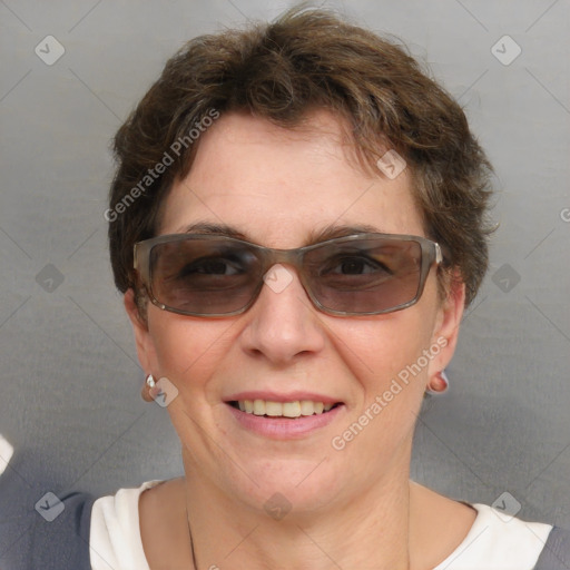 Joyful white adult female with short  brown hair and brown eyes