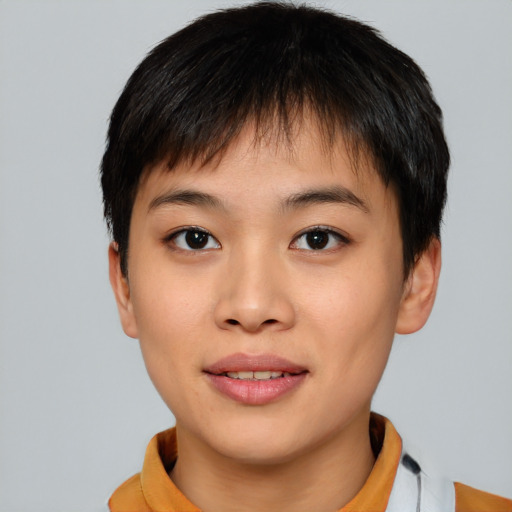 Joyful asian young-adult female with short  brown hair and brown eyes