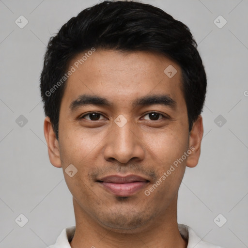 Joyful asian young-adult male with short  black hair and brown eyes