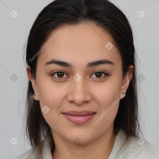 Joyful latino young-adult female with medium  brown hair and brown eyes