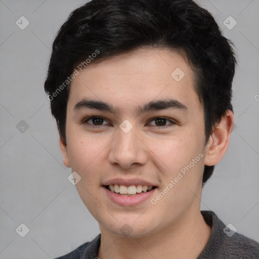 Joyful white young-adult male with short  black hair and brown eyes