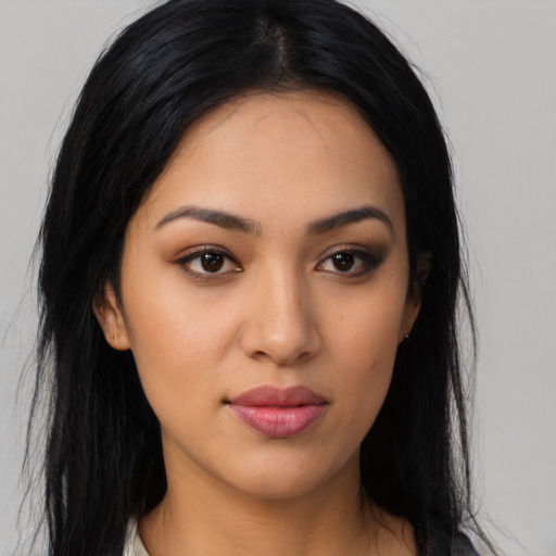 Neutral latino young-adult female with long  black hair and brown eyes