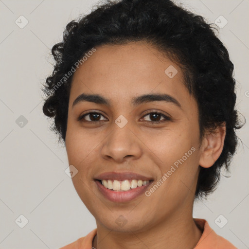 Joyful latino young-adult female with short  black hair and brown eyes