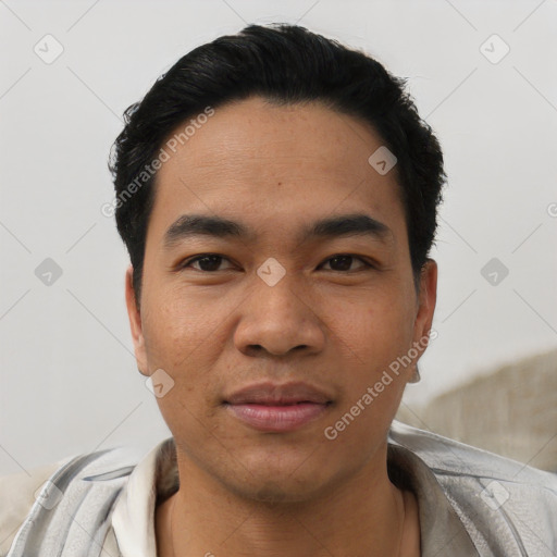 Joyful asian young-adult male with short  black hair and brown eyes