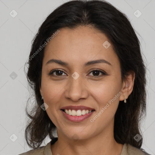 Joyful latino young-adult female with long  brown hair and brown eyes