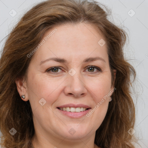 Joyful white adult female with long  brown hair and brown eyes