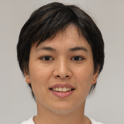 Joyful asian young-adult female with medium  brown hair and brown eyes