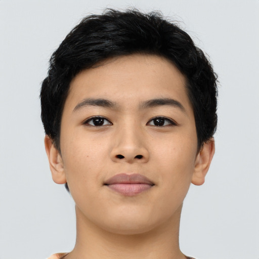 Joyful asian young-adult male with short  black hair and brown eyes