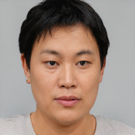 Neutral asian young-adult male with short  brown hair and brown eyes