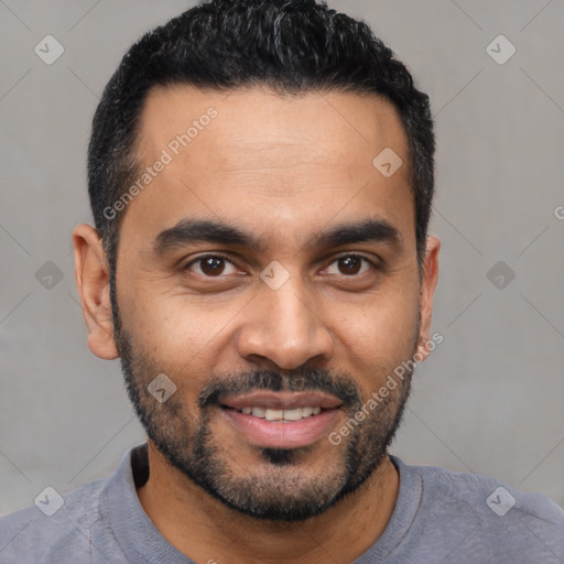 Joyful latino young-adult male with short  black hair and brown eyes