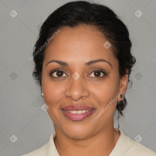 Joyful black adult female with medium  brown hair and brown eyes