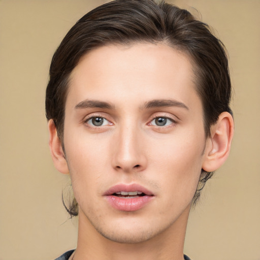 Joyful white young-adult male with medium  brown hair and brown eyes