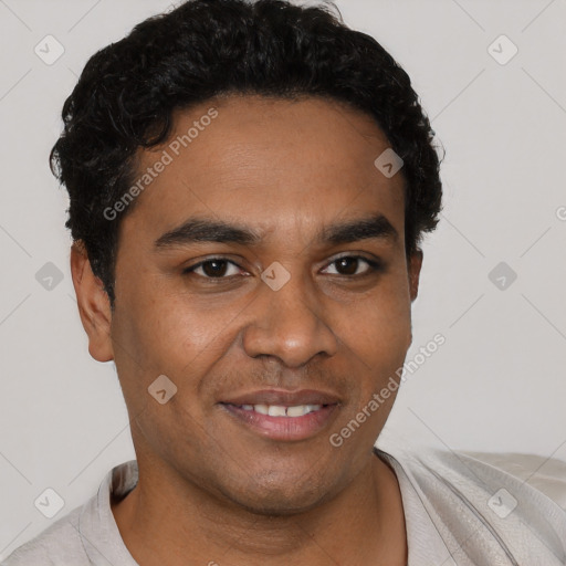 Joyful black young-adult male with short  black hair and brown eyes