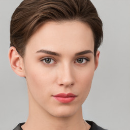 Neutral white young-adult female with short  brown hair and brown eyes